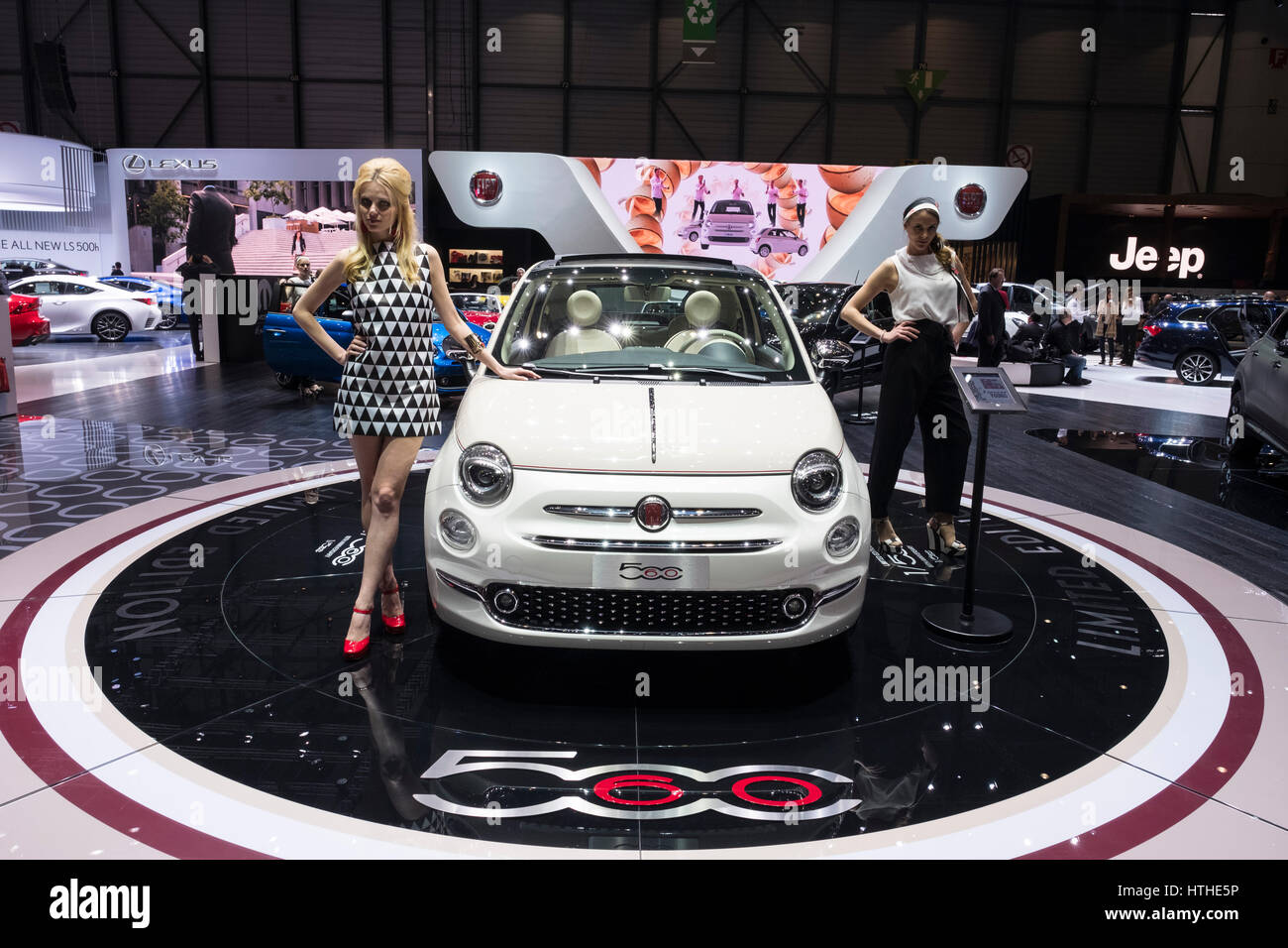 Models posing beside Fiat 500 car at 87th Geneva International Motor Show in Geneva Switzerland 2017 Stock Photo