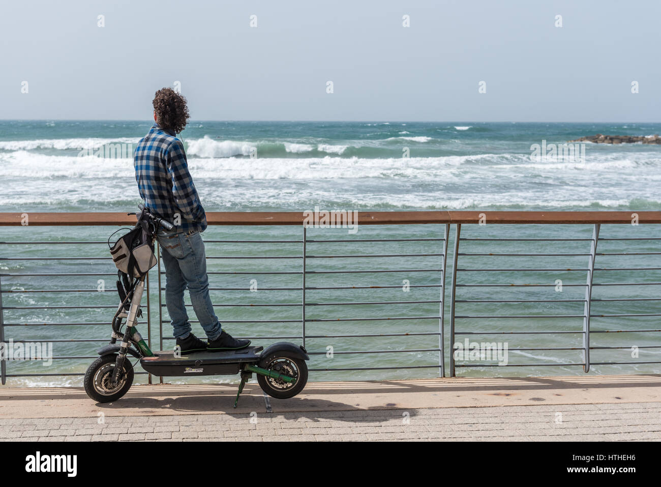 Man on electric scooter hi-res stock photography and images - Alamy