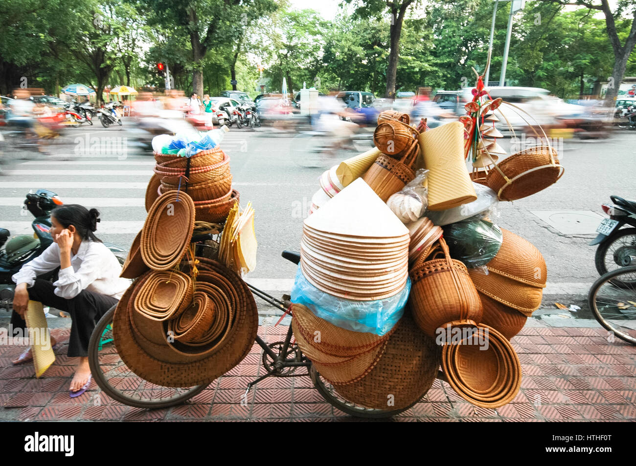 sellers of typical vietnamese straw hats in hanoi, vietnam Stock Photo