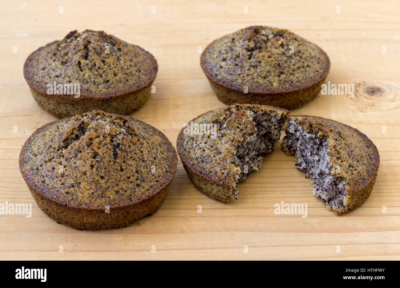 Homemade cakes with poppy seeds on a wooden background Stock Photo
