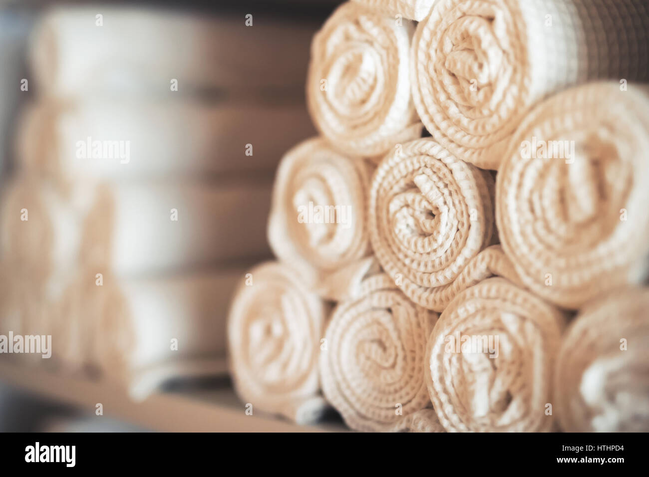 White clean towels in spa massage room as background Stock Photo