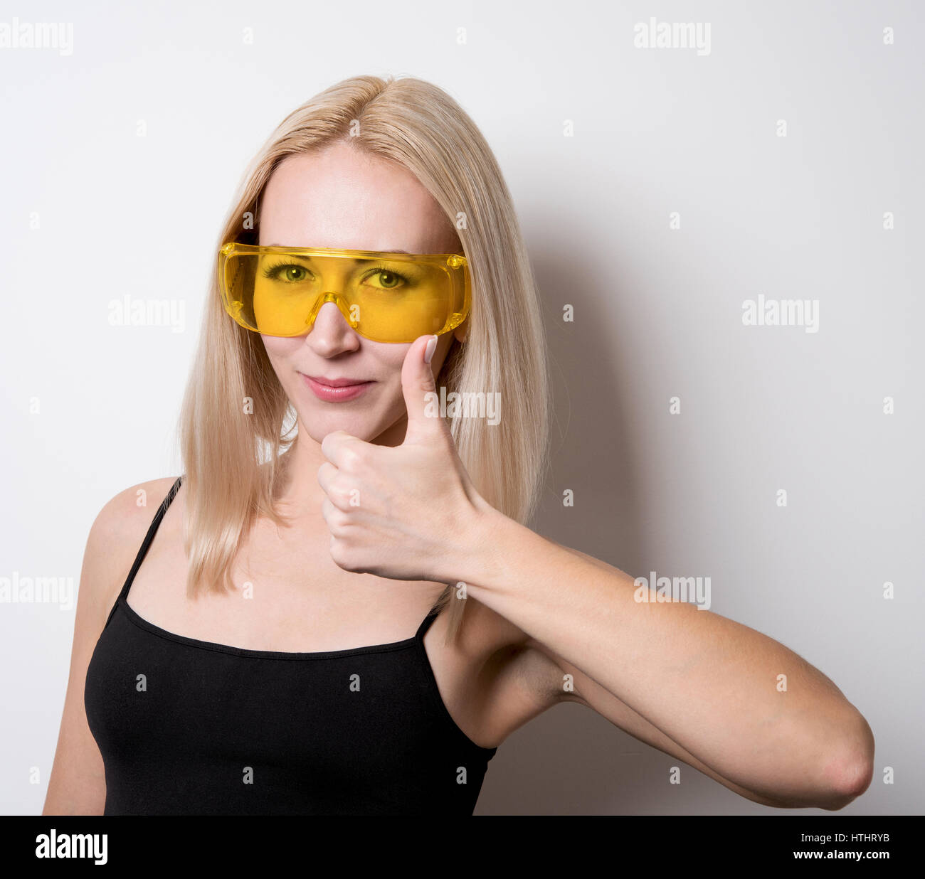 girl in the yellow safety glasses Stock Photo Alamy