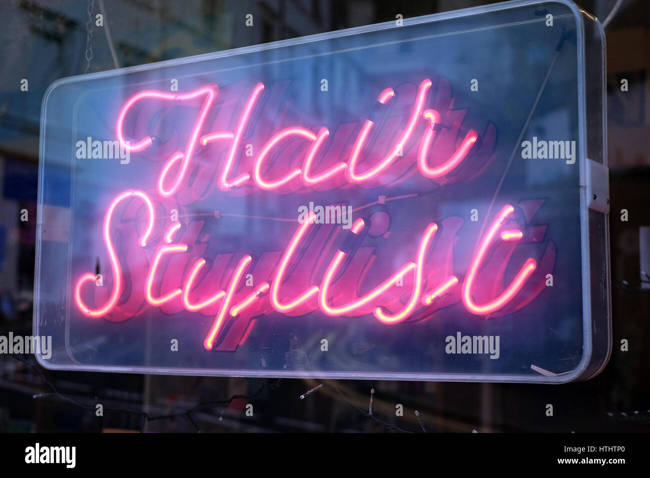 'Hair Stylist' sign in window of barber's in Malvern Stock Photo