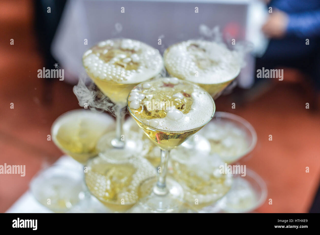 Pyramid Of Champagne Glasses With Dry Ice Vapor Ready For