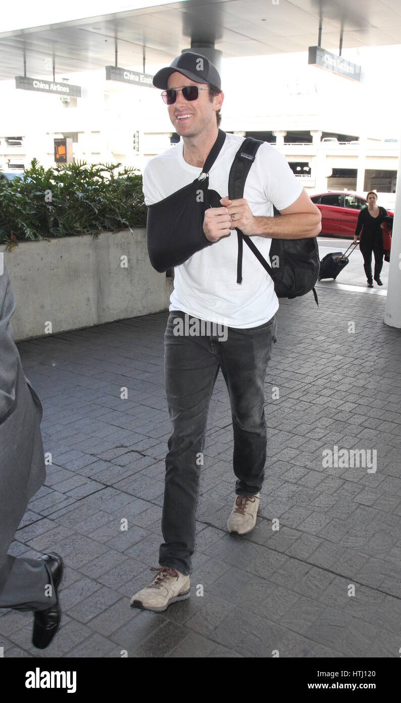 Armie Hammer causally dressed with his arm sling as he departs from Los Angeles International Airport (LAX)  Featuring: Armie Hammer Where: Los Angeles, California, United States When: 08 Feb 2017 Stock Photo