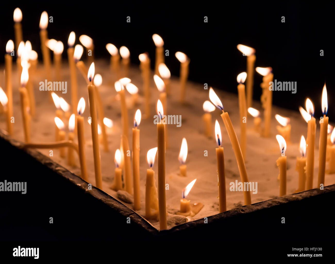 closeup of burning candle isolated on black background Stock Photo - Alamy