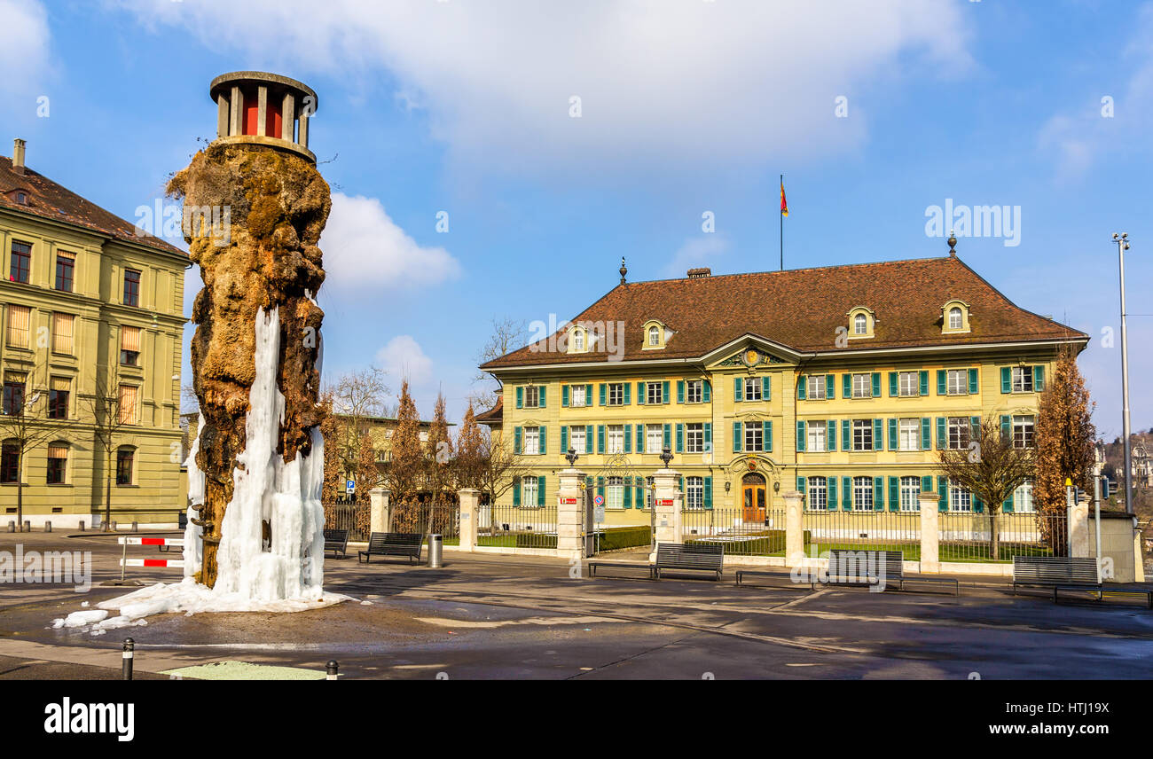 Frozen Meret Oppenheim Fountain and Police office in Bern, Switzerland Stock Photo