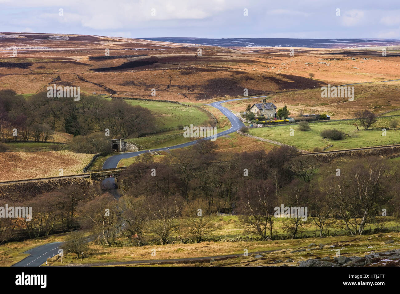 The North York Moors with isolated farmhouse surrounded by moorland and ...