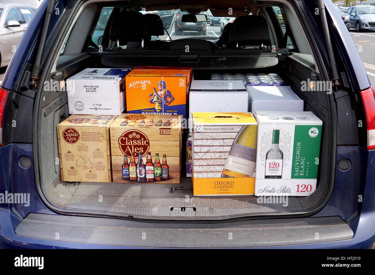 COQUELLES, PAS-DE-CALAIS, FRANCE, MAY 07 2016: Car boot loaded with cheap beer and wine Stock Photo