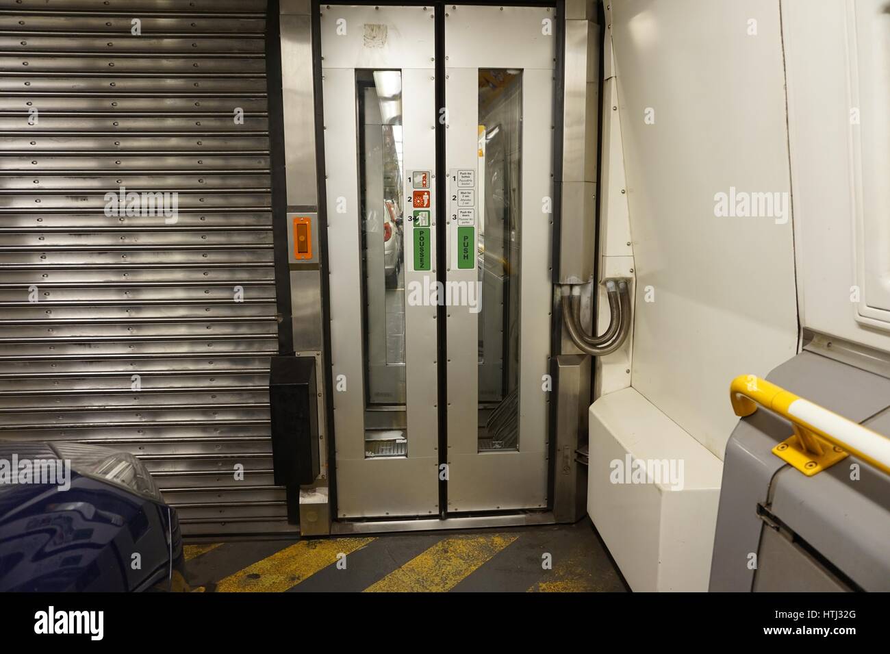 FOLKESTONE, ENGLAND, MAY 07 2016: Connecting doors between carriages on the Euro Tunnel train from Coquelles, France to Folkestone in the United Kingd Stock Photo
