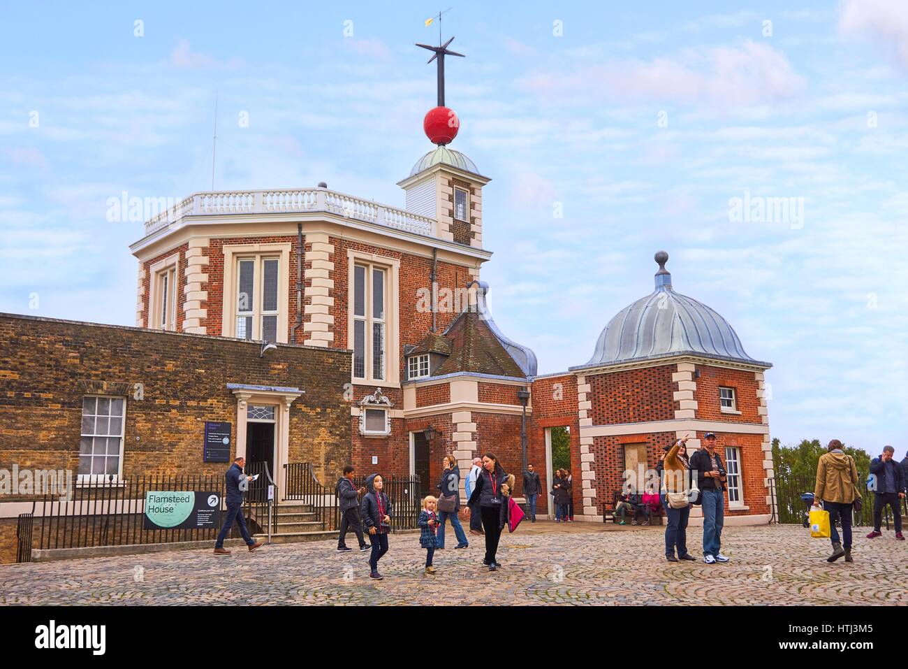 Greenwich, London, UK - October 30 2016: Unidentified visitors at Flamsteed House with the famous red Time Ball at Greenwich Observatory Stock Photo
