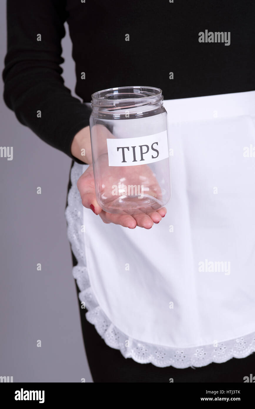 Waitress holding an empty tips jar Stock Photo Alamy