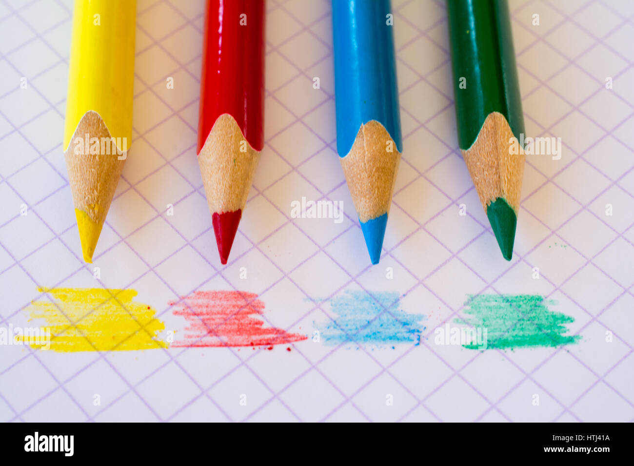 Coloured pencils on paper painted in the same colours. Stock Photo