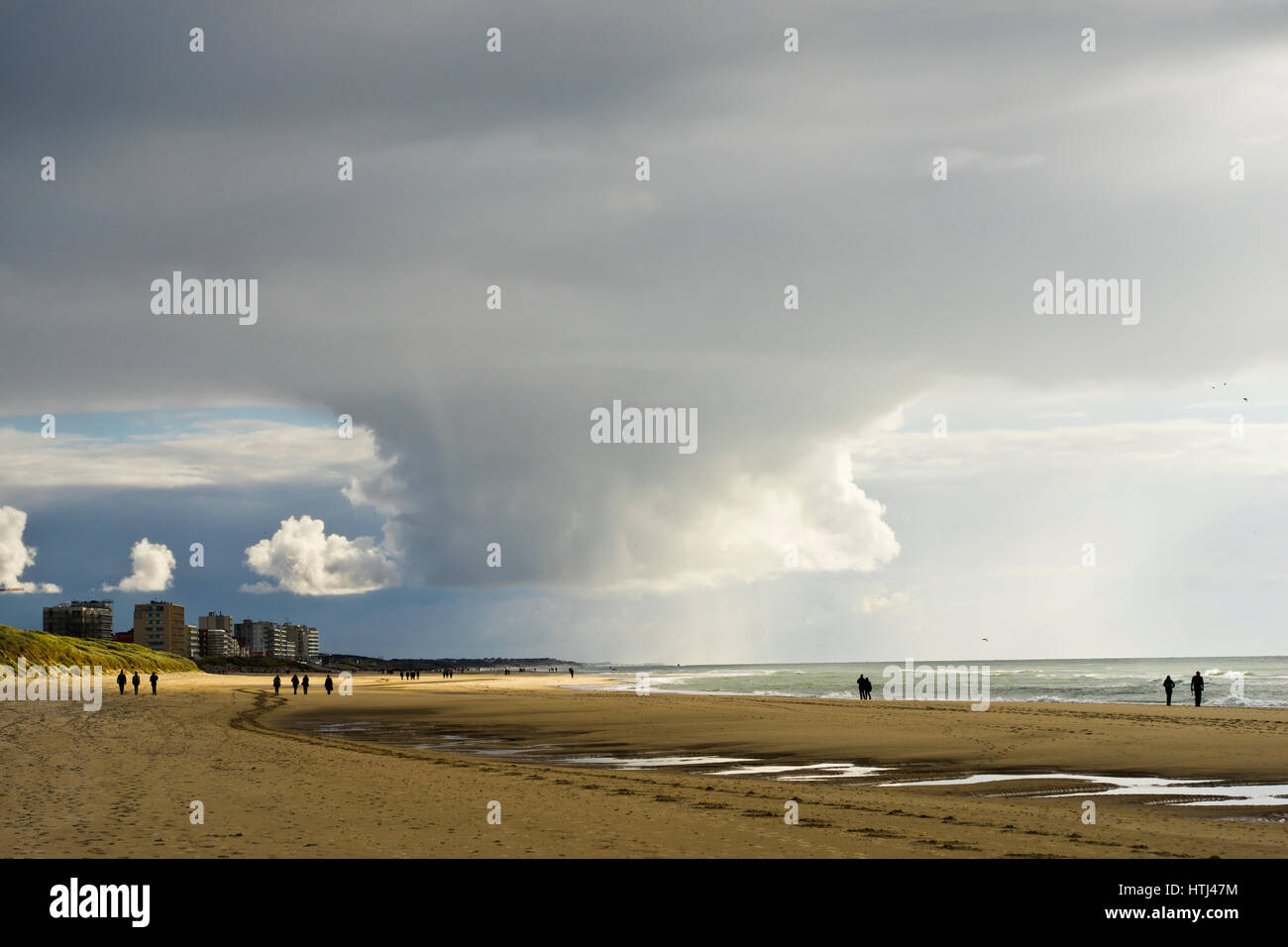 huge rain cloud at Hardelot beach, Cote d Opale, North-West France Stock Photo