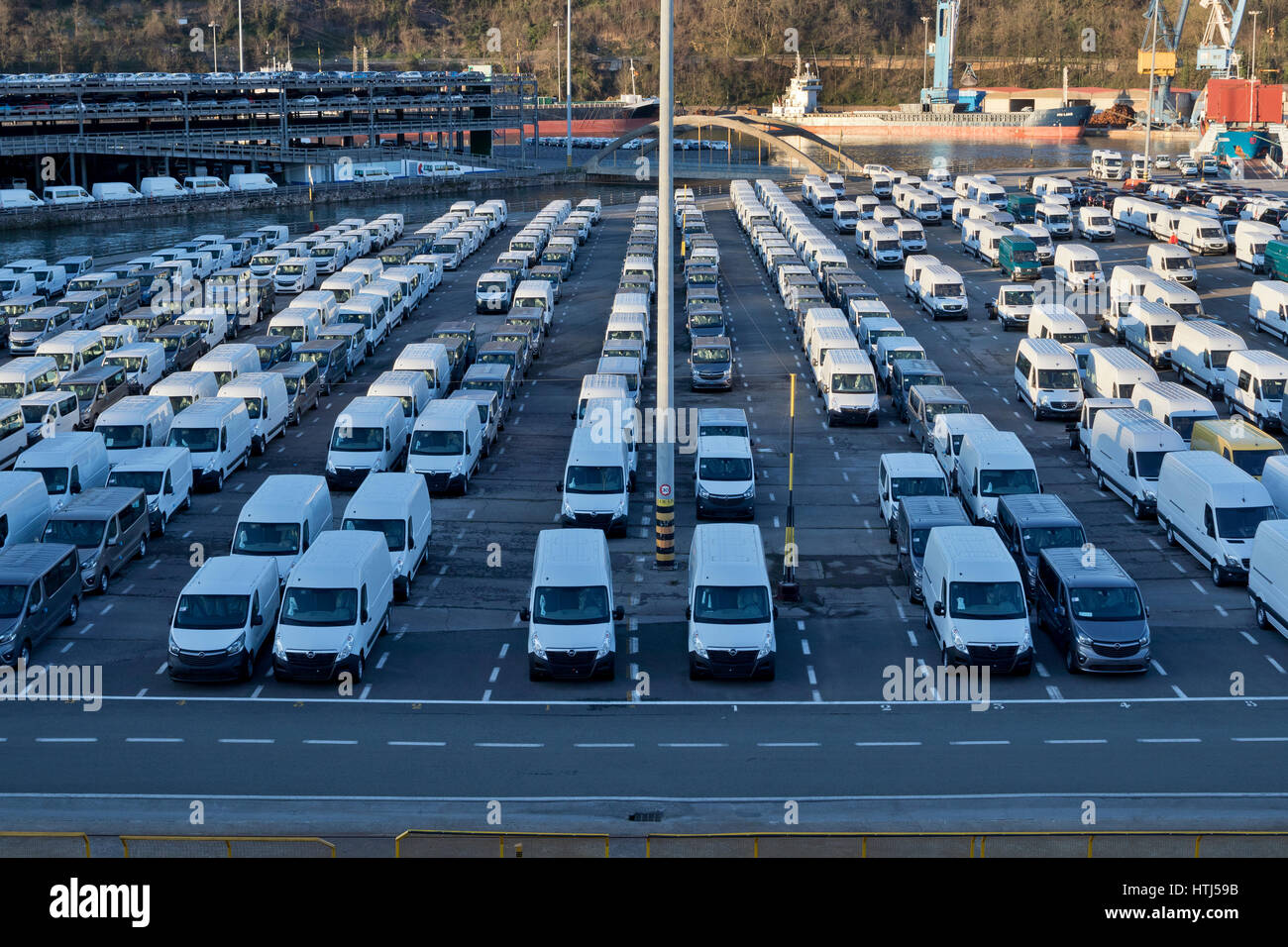 Pasajes Sea port park full of new Opel and Mercedes vans in perspective in Guipuzcoa (Basque country, Spain) 2017. Stock Photo