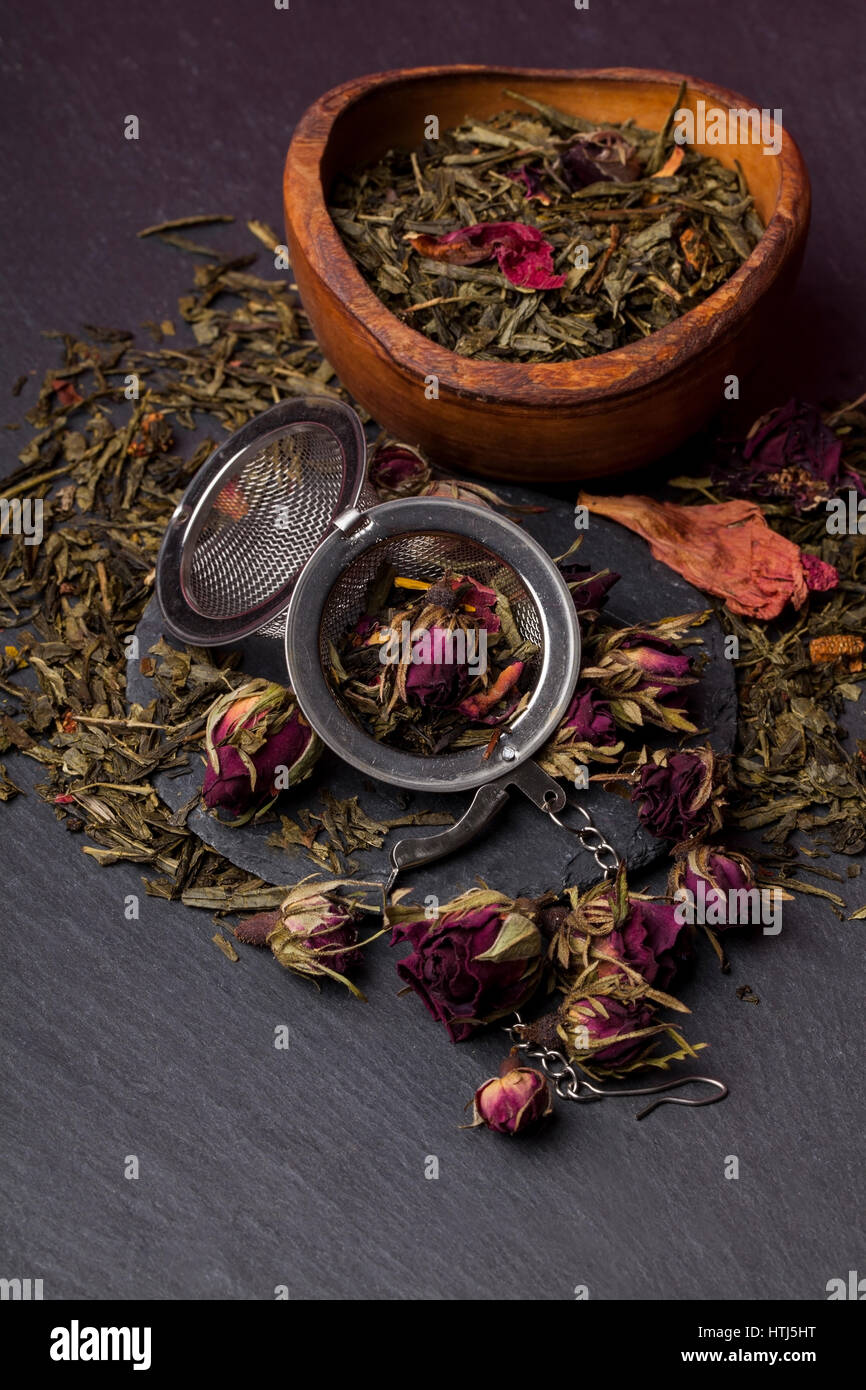 Green tea with roses blossoms Stock Photo