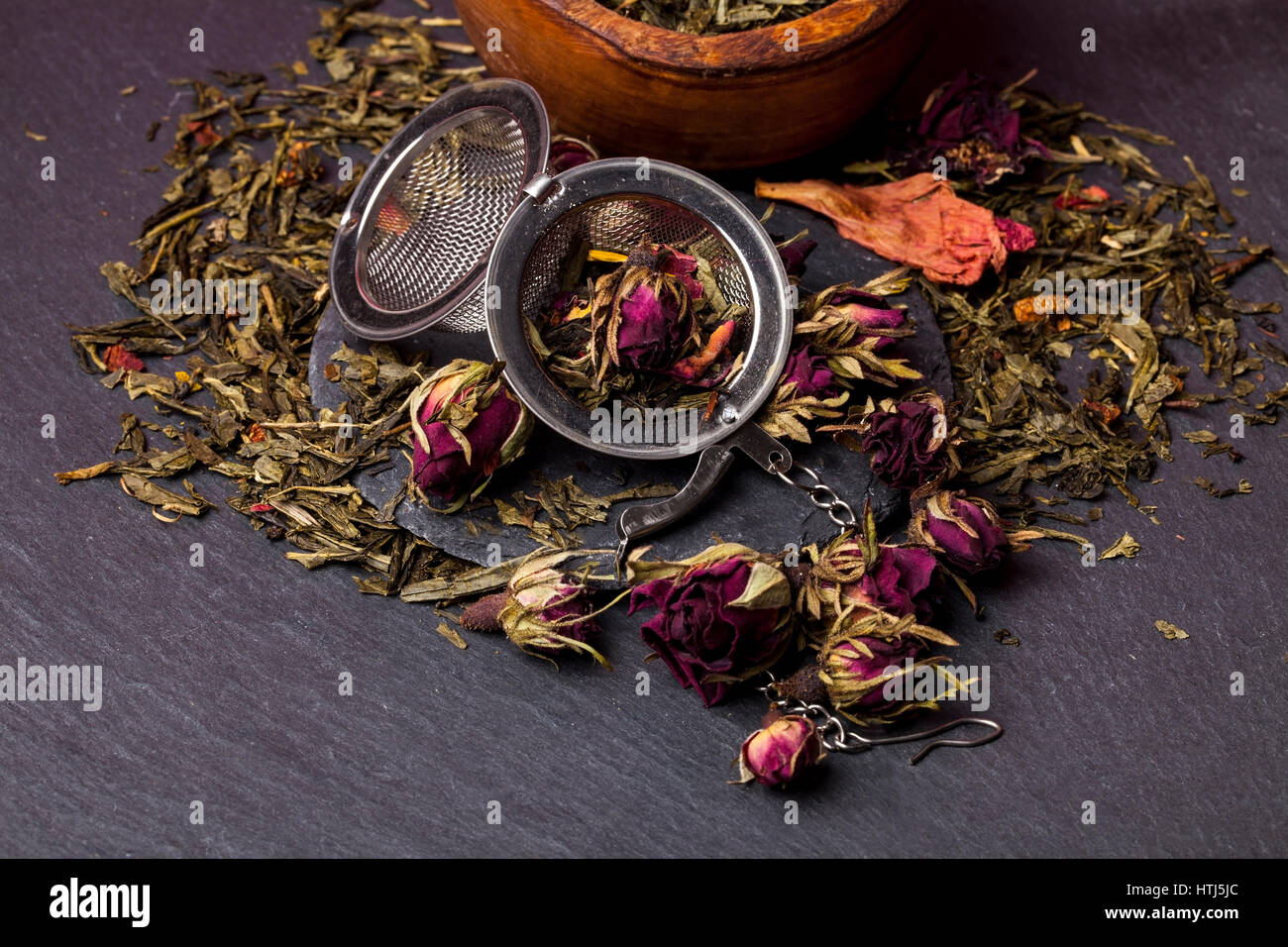 Green tea with roses blossoms Stock Photo