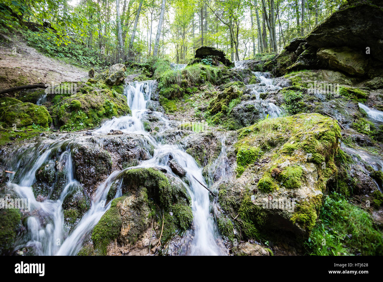 rocky waterfall in summer with stream and low water in forest Stock ...