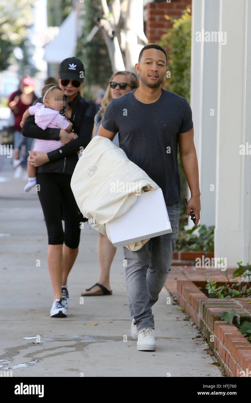 Chrissy Teigen And John Legend Shop At The Row With Their Daughter Stock Photo Alamy
