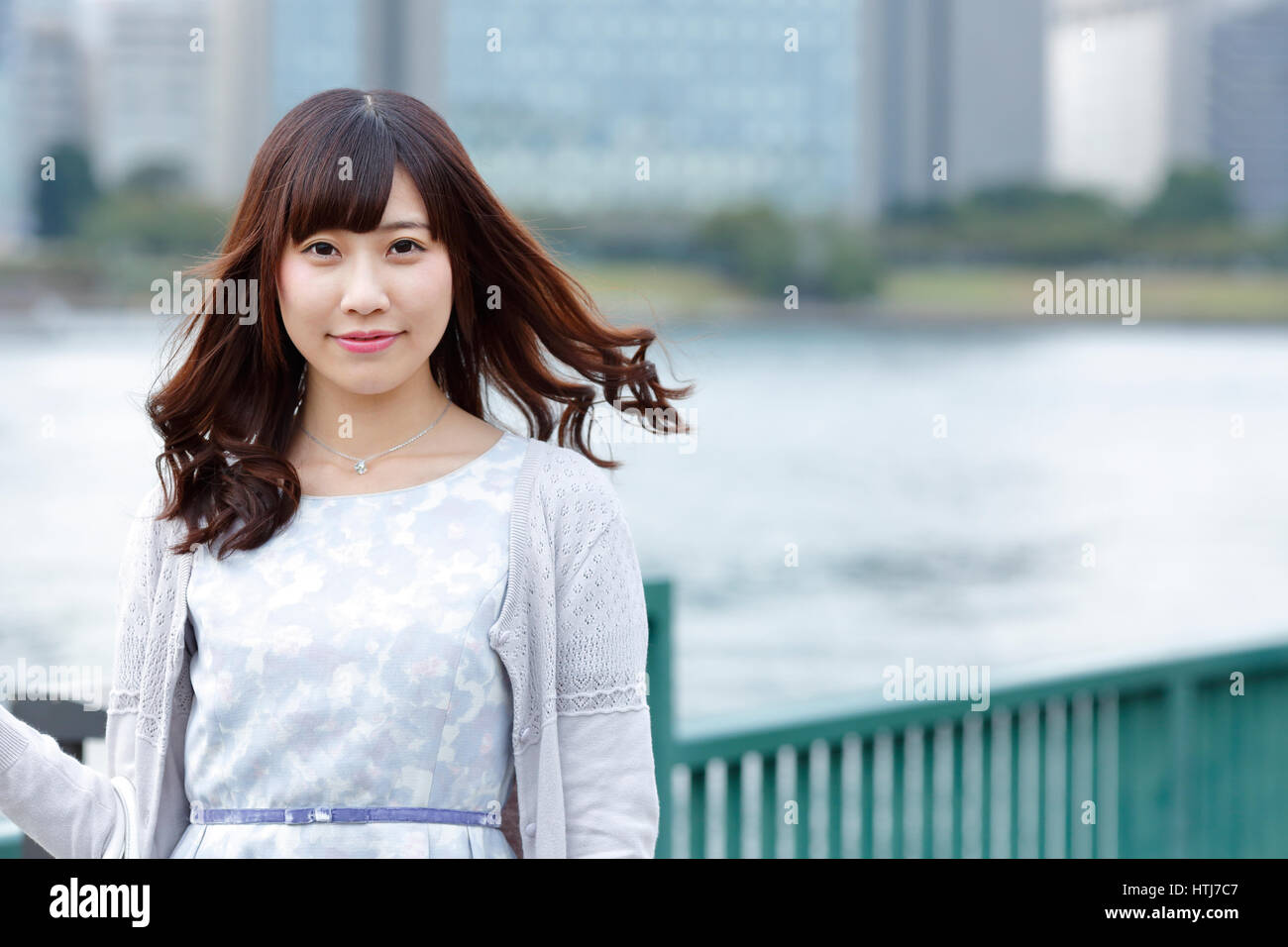Fashionable Japanese woman by the river, Tokyo, Japan Stock Photo