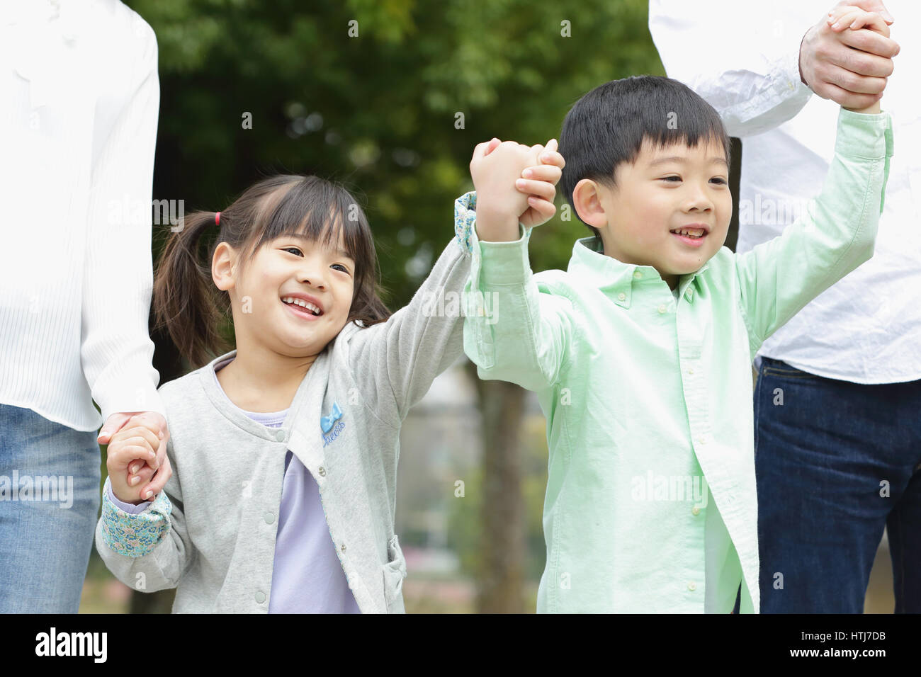 Japanese family in a city park Stock Photo