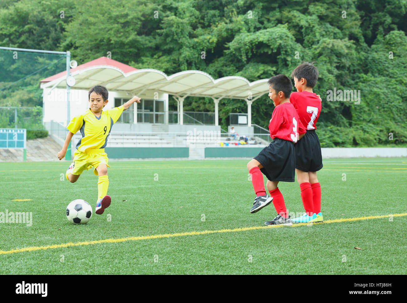 Japanese kids playing soccer Stock Photo Alamy