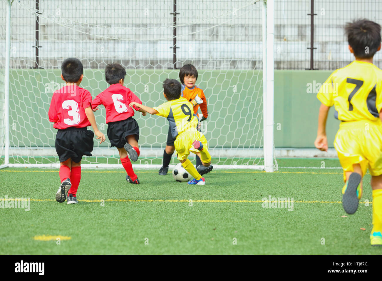 Japanese kids playing soccer Stock Photo Alamy