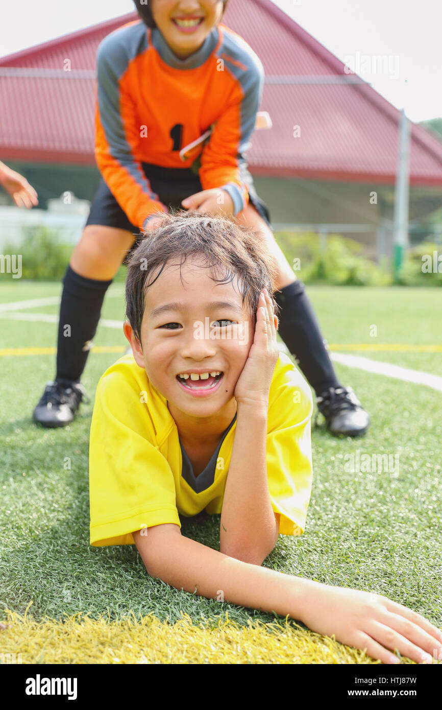 Japanese kids playing soccer Stock Photo Alamy