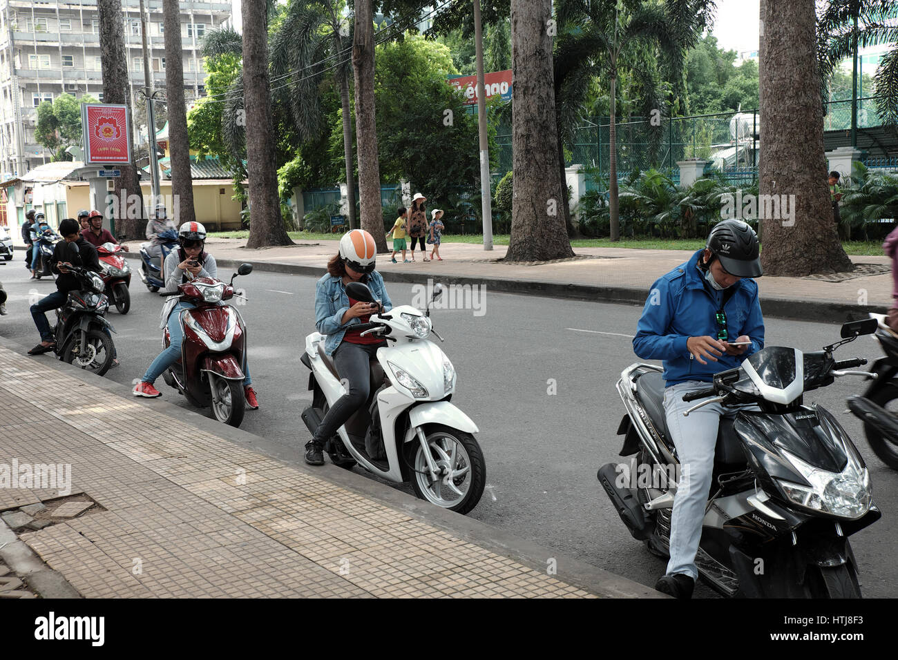 Ho Chi Minh City Viet Nam Vietnamese People Stop Motorbike Play Pokemon Go Hot Game On Smart Phone Gamer Sit On Motorcycle Tao Dan Park Vietnam Stock Photo Alamy