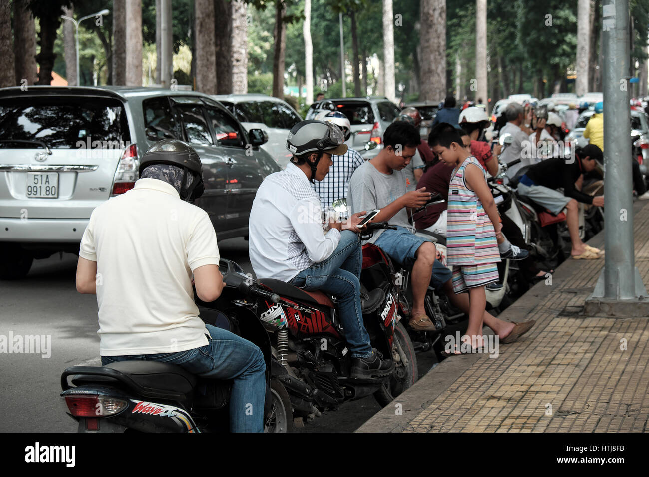 Ho Chi Minh City Viet Nam Vietnamese People Stop Motorbike Play Pokemon Go Hot Game On Smart Phone Gamer Sit On Motorcycle Tao Dan Park Vietnam Stock Photo Alamy