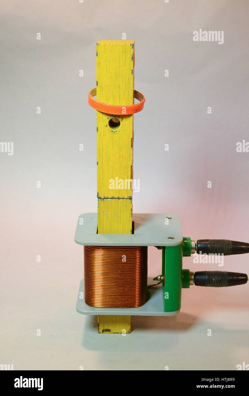 A metal ring hovers on the iron kernel of a coil as long as alternating ...