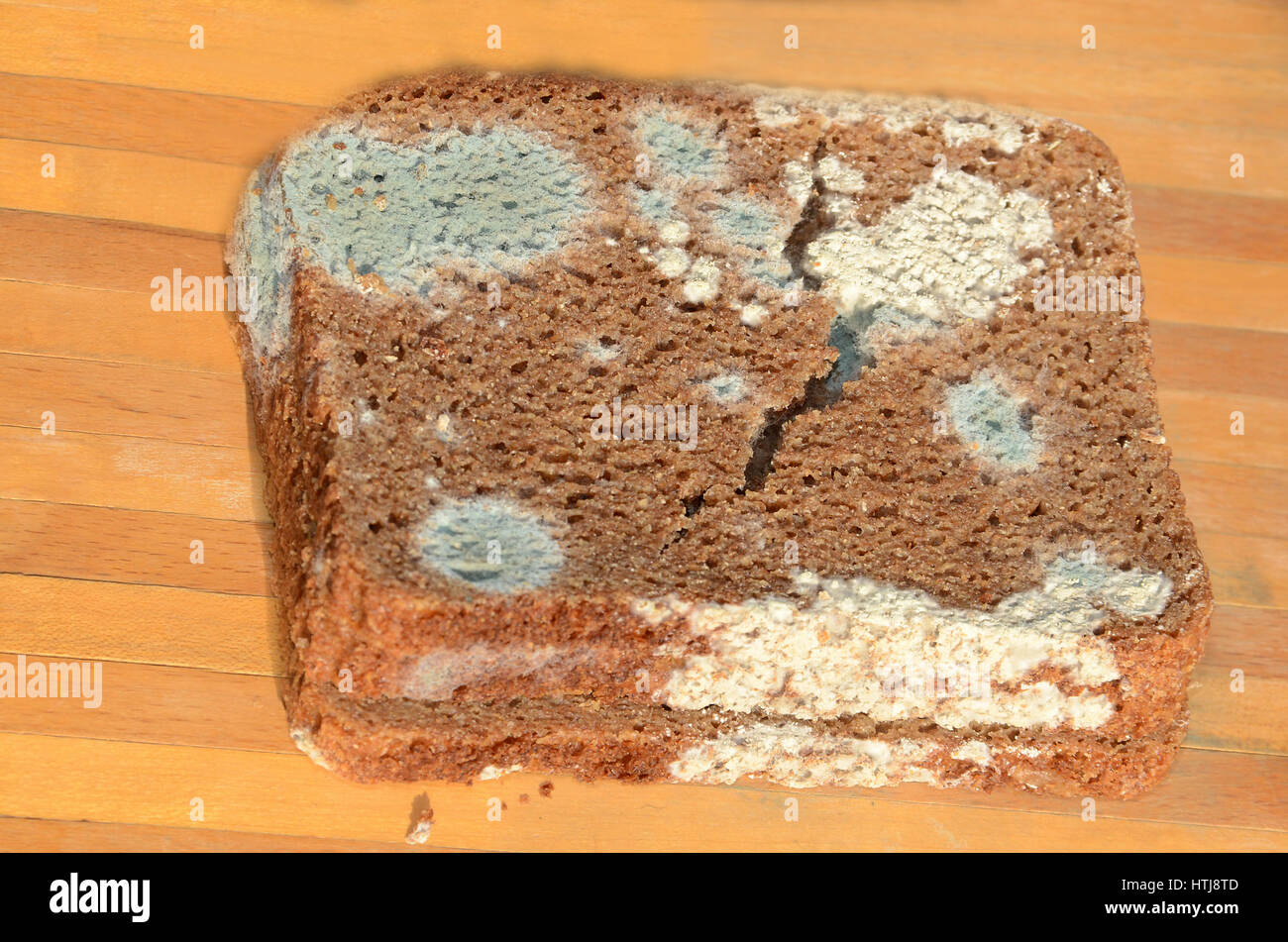 Slices of black bread where the best before date has definitely been exceeded. Stock Photo