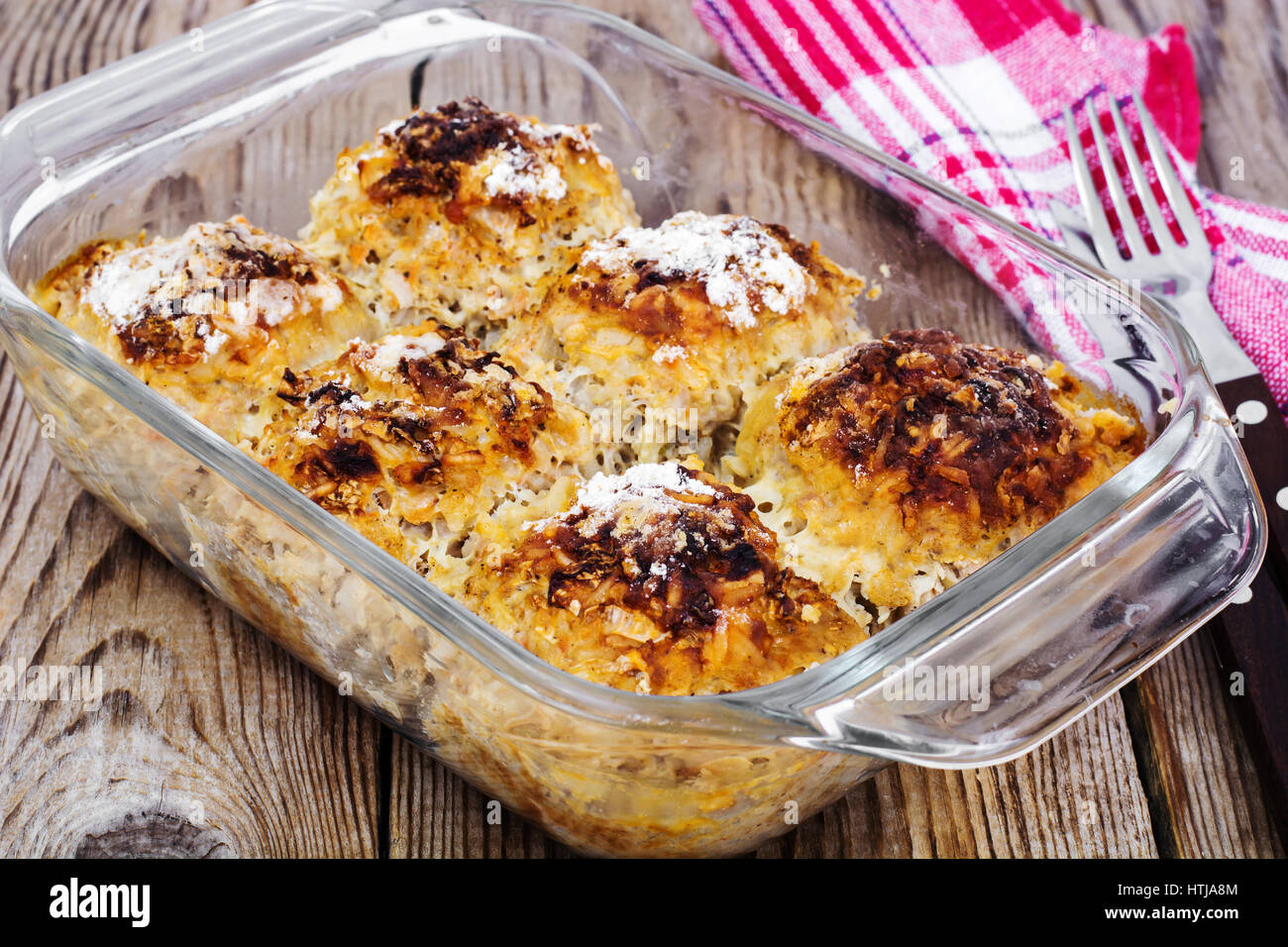 Baked meatballs with rice and vegetables in glass form Studio Photo