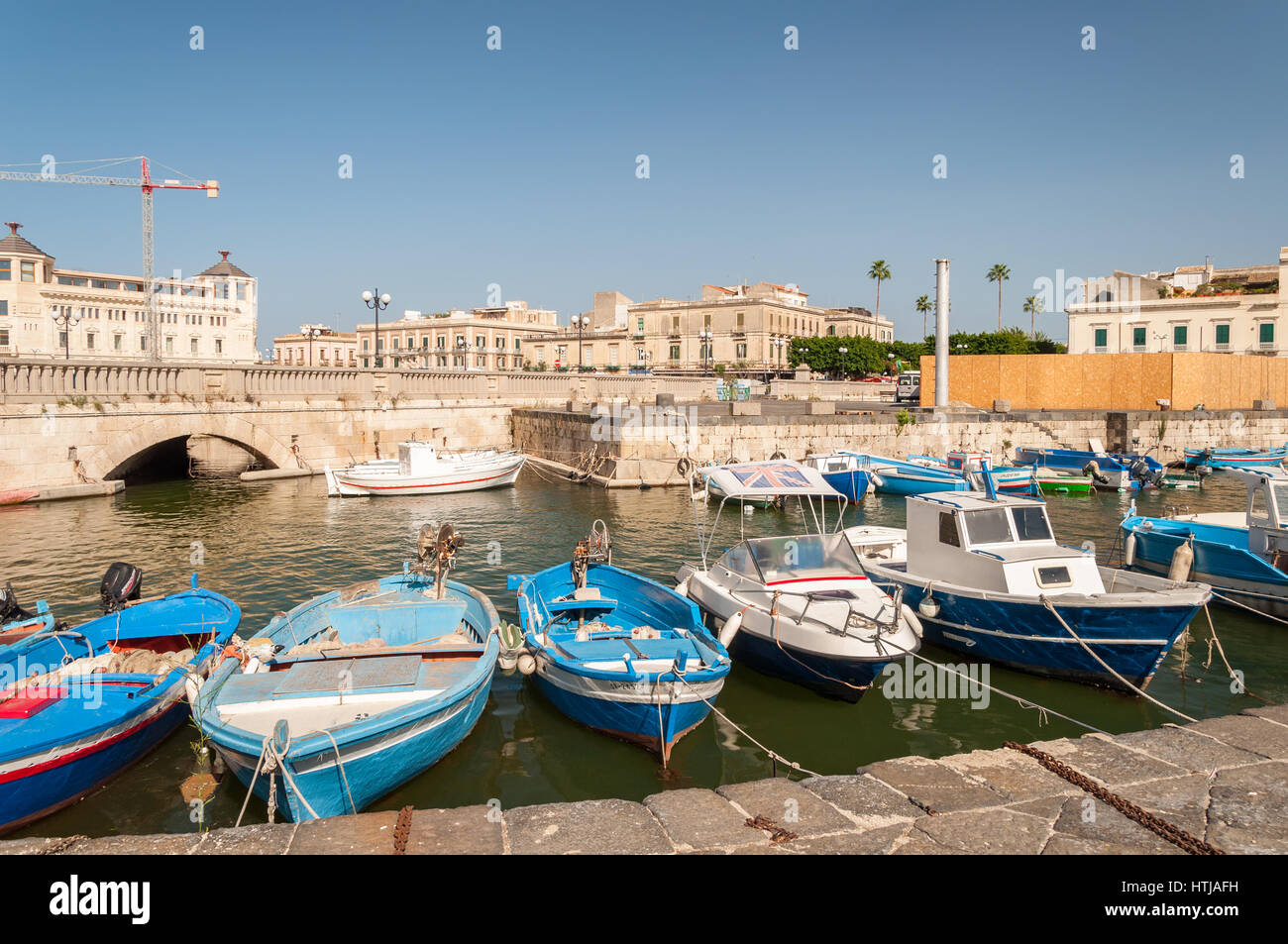 SYRACUSE, ITALY - SEPTEMBER 14, 2015: Fishing boats in the city of Syracuse, Sicily Stock Photo