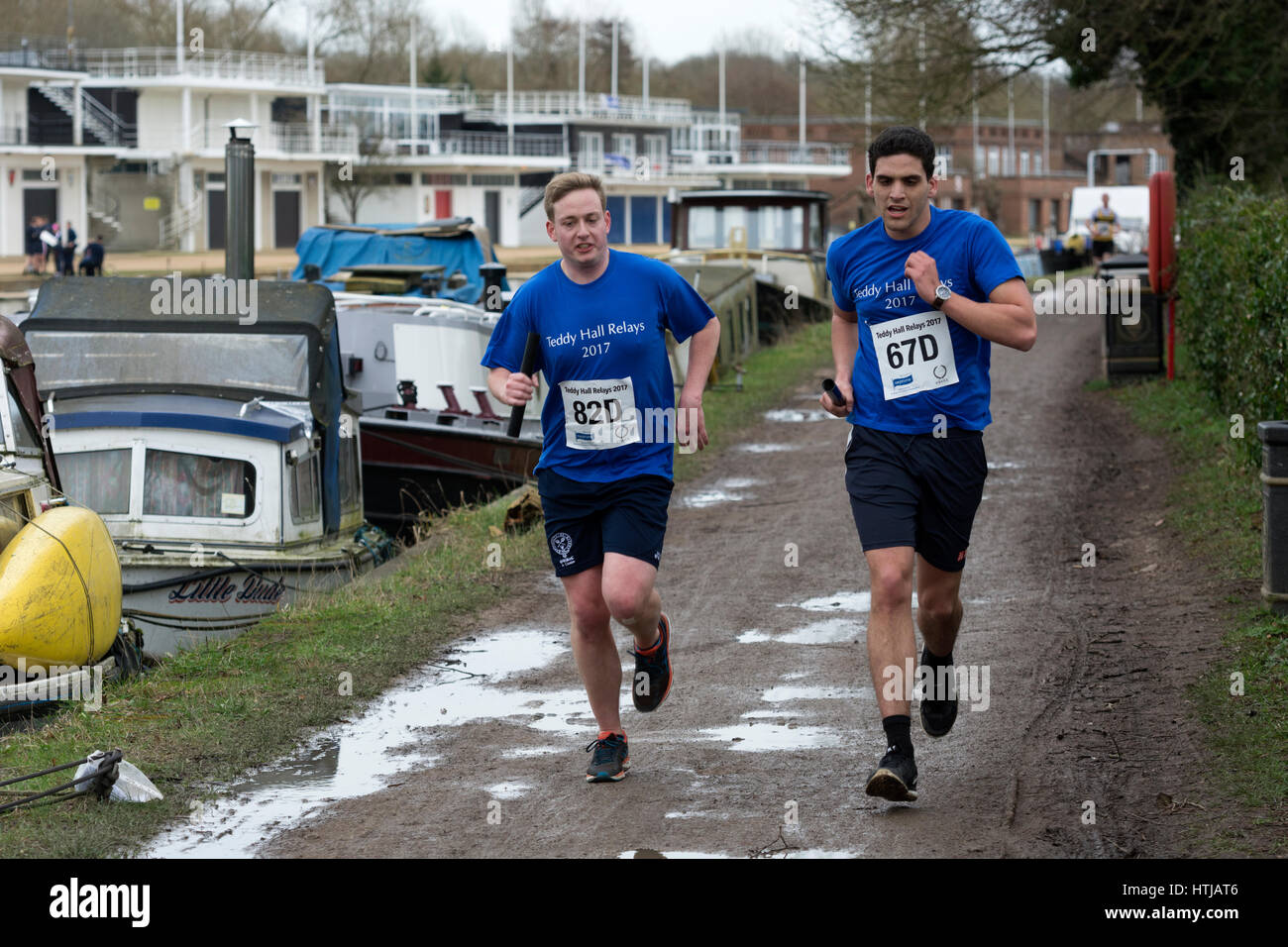 Runners on the River Thames towpath in the Teddy Hall Relays, Oxford