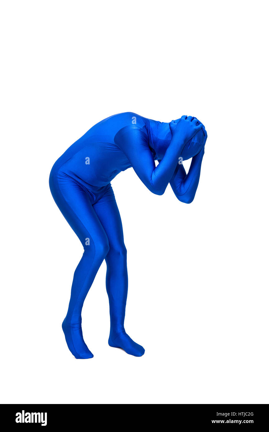 Mysterious blue man in costume holds head Stock Photo