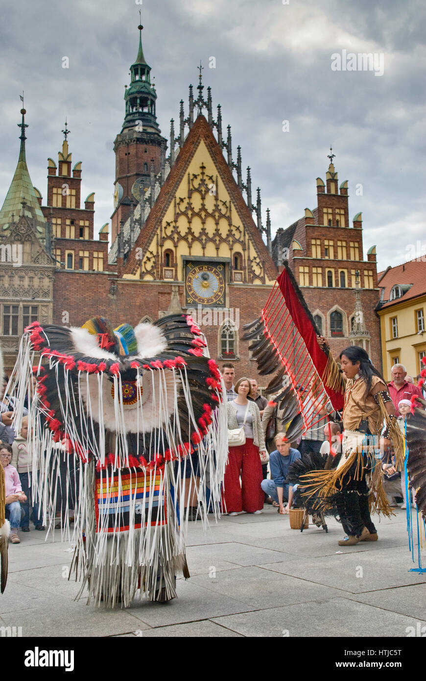 South American Indians performing at Rynek in front of medieval Town Hall in Wroclaw, Lower Silesia, Poland Stock Photo