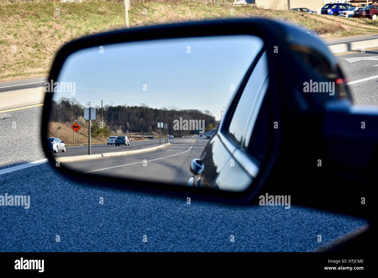 Side mirror view from drivers seat Stock Photo