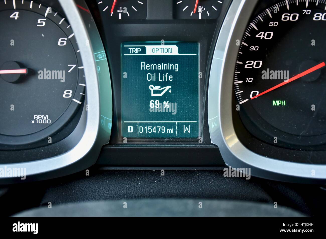 Car dashboard with oil remaining light Stock Photo Alamy