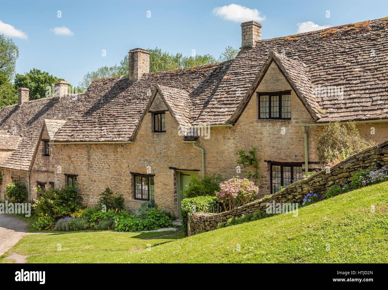 Cottages at the Arlington Row in the village of Bibury, England, Gloucestershire, England, UK Stock Photo