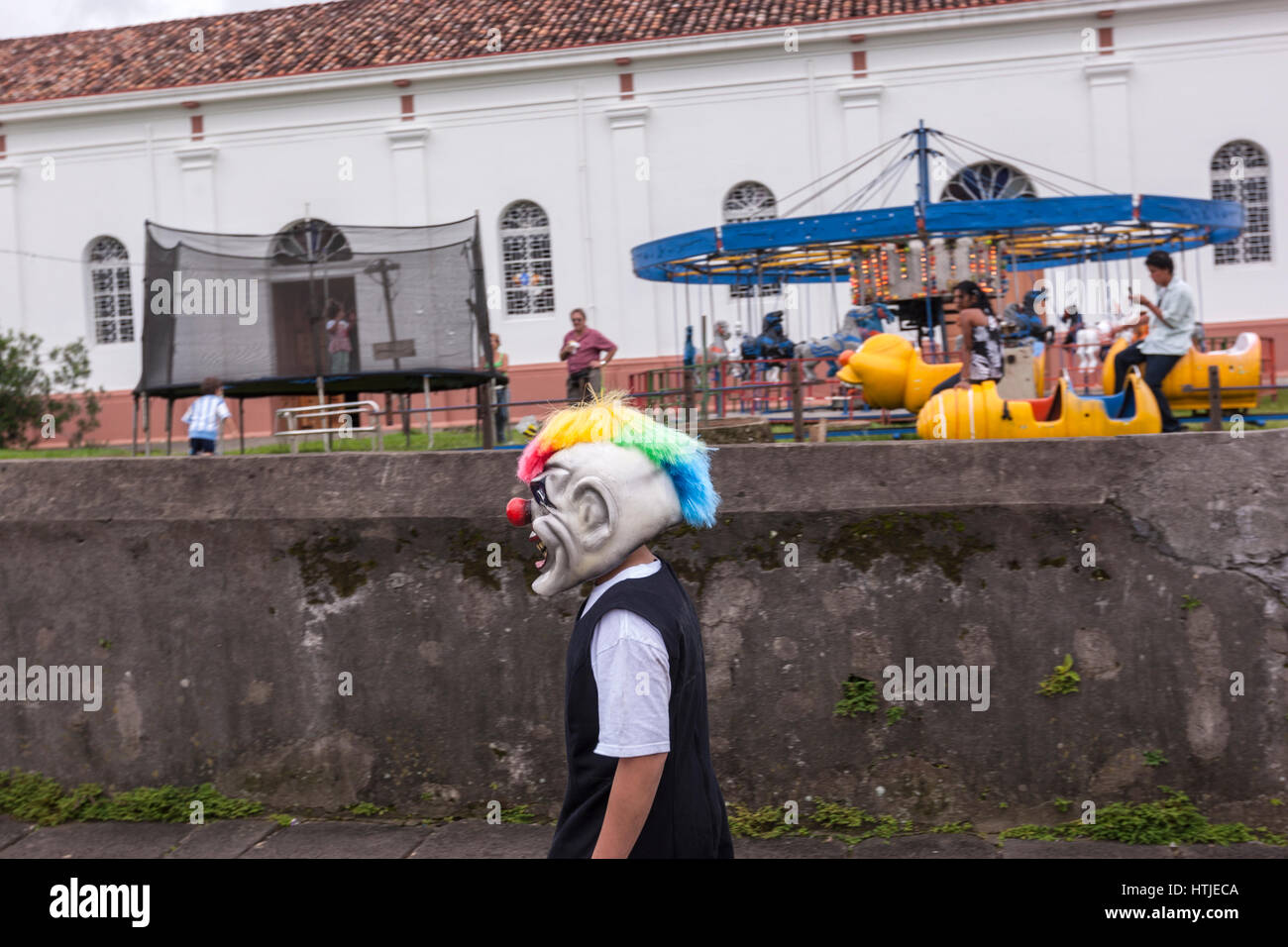 Boy with mask in traditional Masquerade fiesta with masks and  cow bladder, Barva, Heredia, Costa Rica Stock Photo