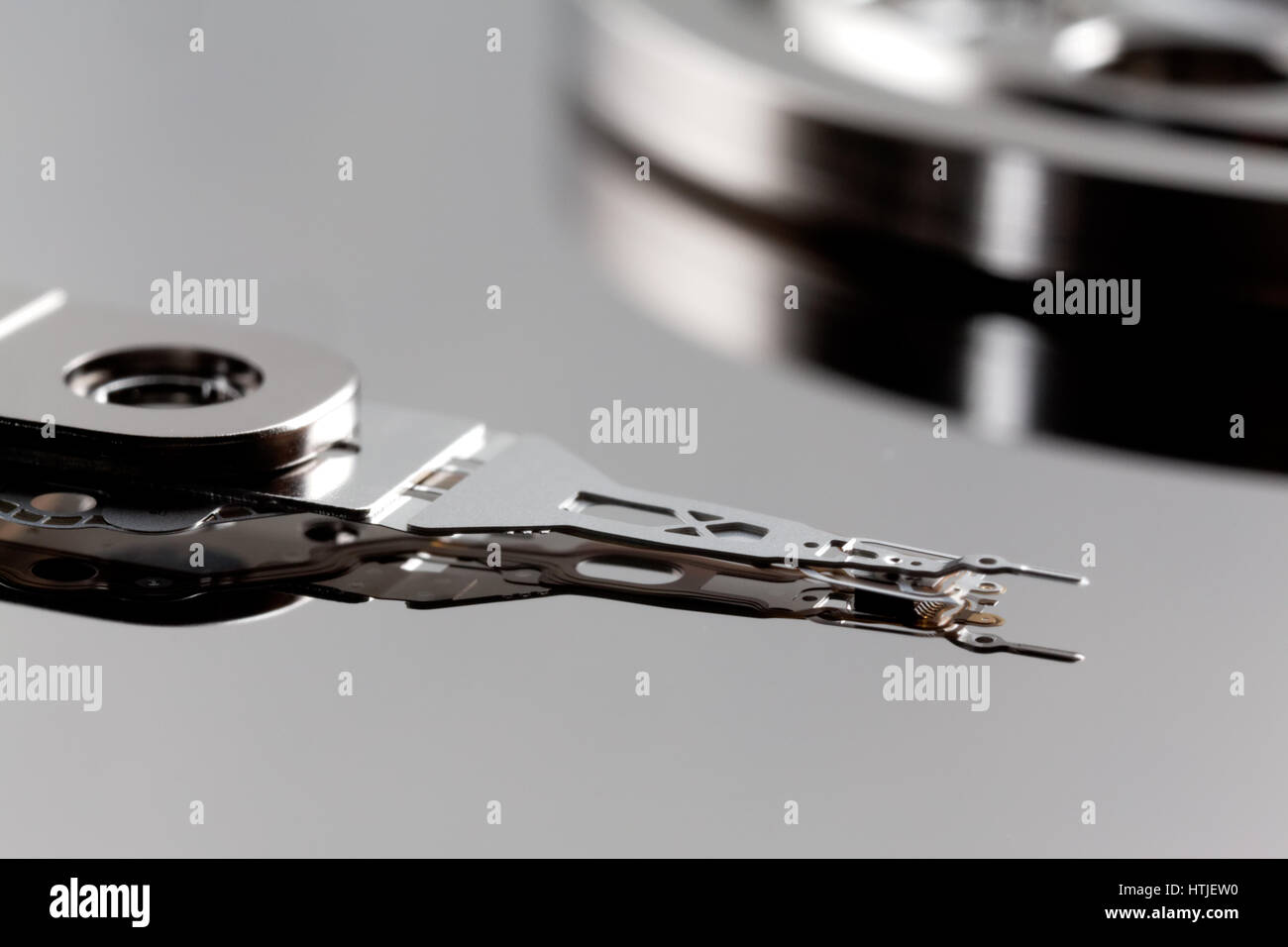 Close-up of read-and-write head and disk platter in hard disk drive Stock Photo