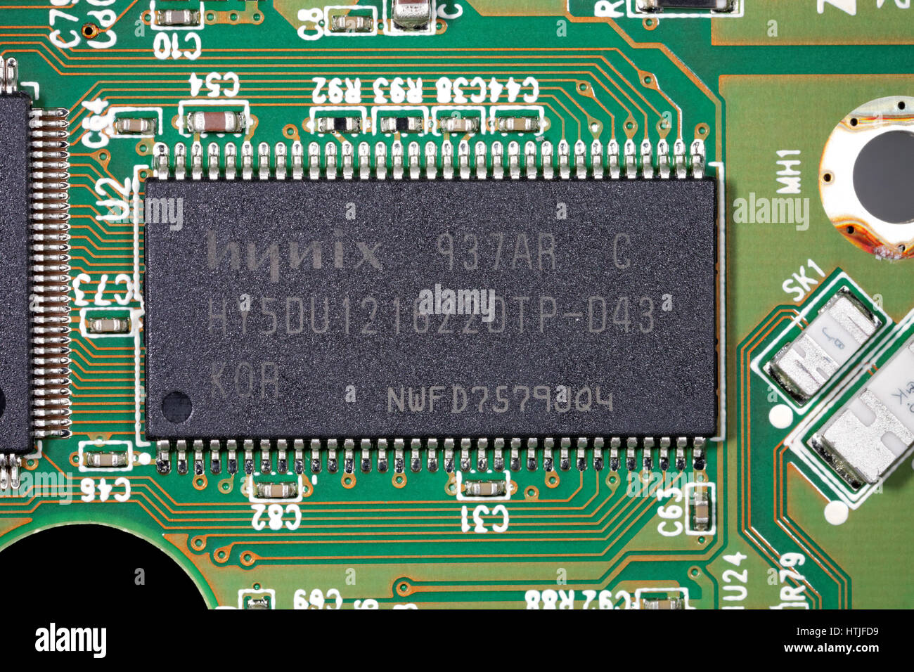 Close-up of Hynix hy5du121622dtp synchronous DRAM integrated circuit on hard disk drive printed circuit board Stock Photo