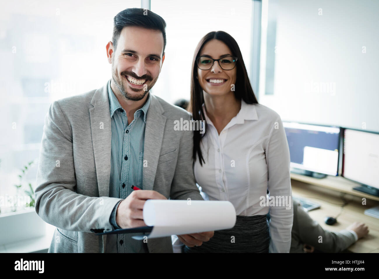 Professional business colleagues working in modern office Stock Photo ...