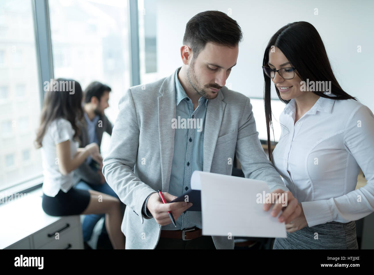 Professional business colleagues working in modern office Stock Photo ...