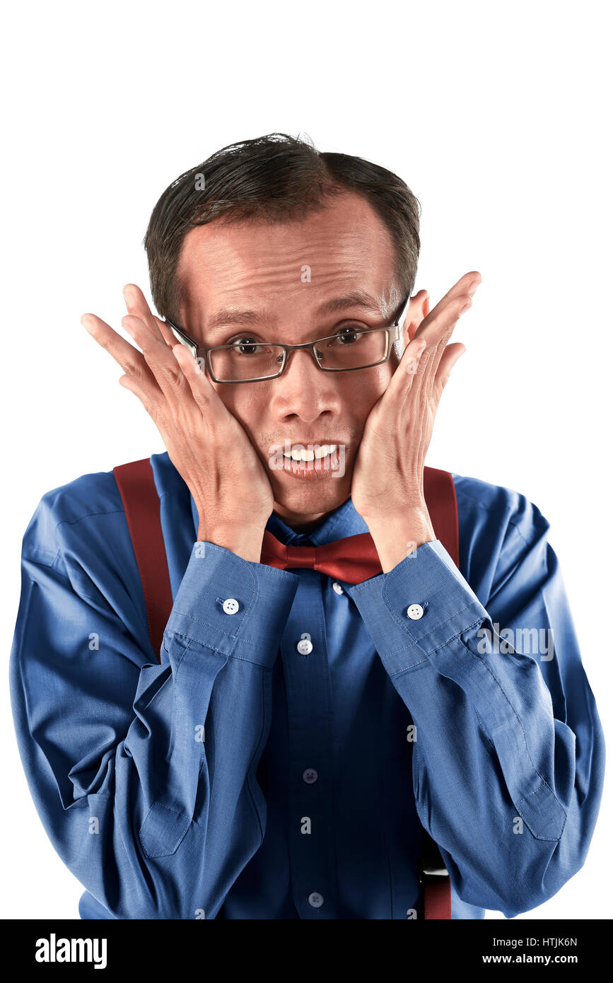 Young asian nerd man with funny expression isolated over white background Stock Photo