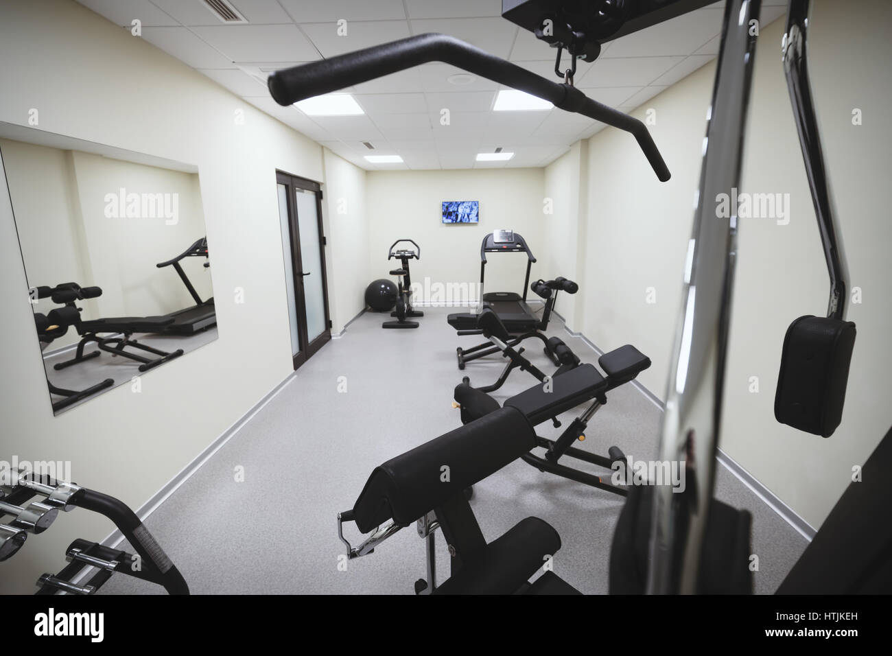 Gym equipped with weights and various machines Stock Photo Alamy