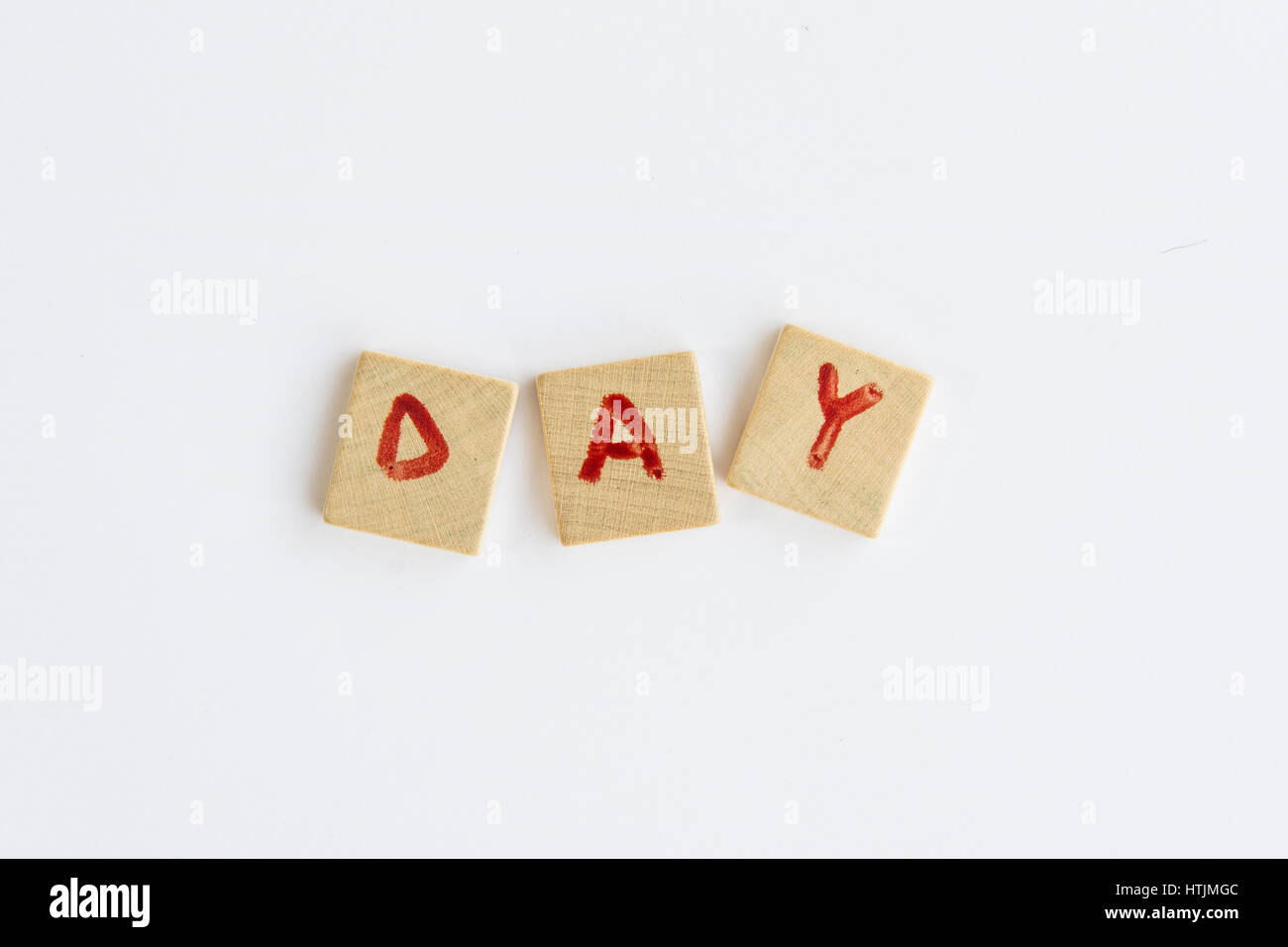 the word Day  formed with letters written on squares of wood dowels Stock Photo