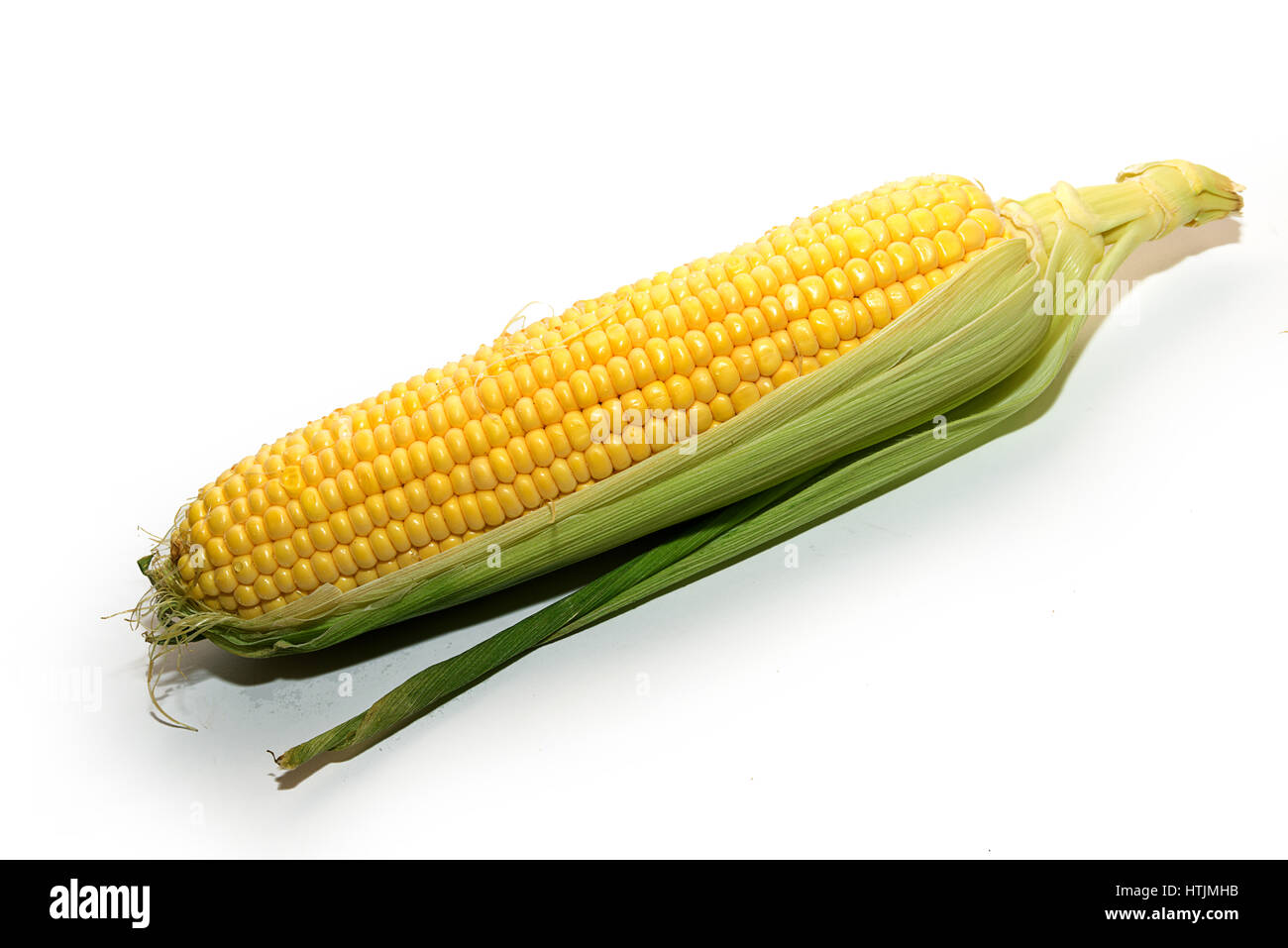 The fruits of ripe yellow corn are on the table Stock Photo