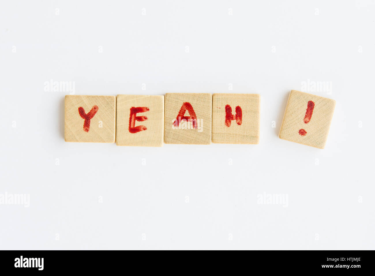 the word Yeah  formed with letters written on squares of wood dowels Stock Photo